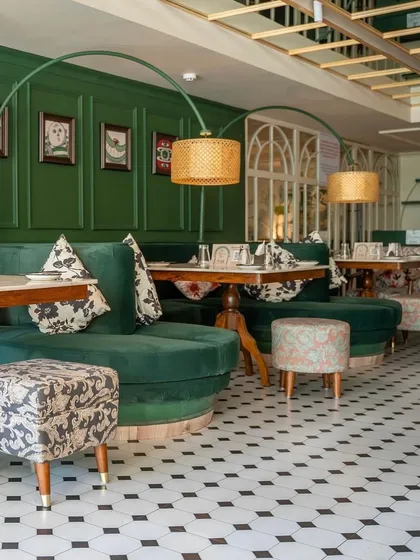 This is a project I completed for "The Drawing Room" by Smoke House Deli, featuring custom-made furniture that brings the entire space to life. I crafted the plush green velvet banquettes, patterned ottomans, and sturdy dining tables to create an enchanting and comfortable dining experience.