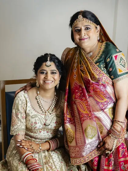 These heartwarming photos show the bride with her parents. I created coordinated, elegant makeup and hair for both the bride and her mother, ensuring everyone felt their best on this special family day.