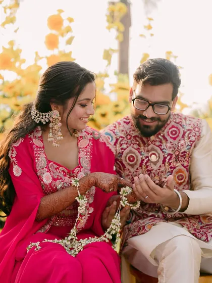 Another lovely shot of the couple with their floral jewelry.