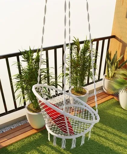 Here is a design concept showing how to blend wood elements from the indoors into a balcony. A macrame swing, wooden deck flooring, and a vertical garden create a cohesive and natural outdoor room.
