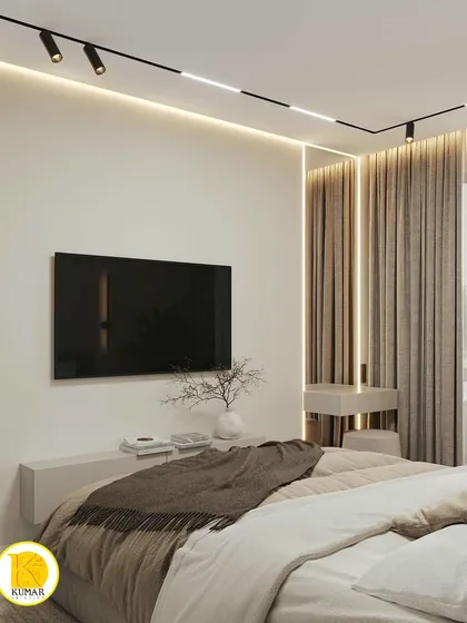 A view from the bed towards the TV, highlighting the clean lines and minimalist aesthetic of the room.