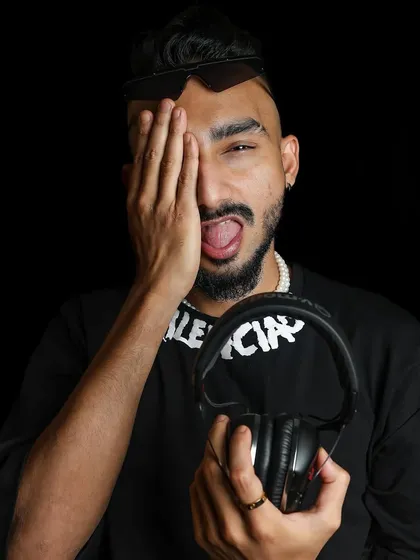 The artist behind the decks. This shot captures the playful and creative energy that defines my persona.