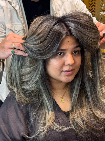 The volume and layers in this ash blond look are simply stunning.