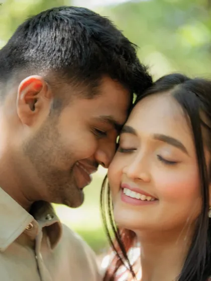 A beautiful, tight close-up of Kevin and Reeti. This shot focuses on their serene expressions and gentle connection, capturing a moment of pure, quiet love in the soft, natural light.