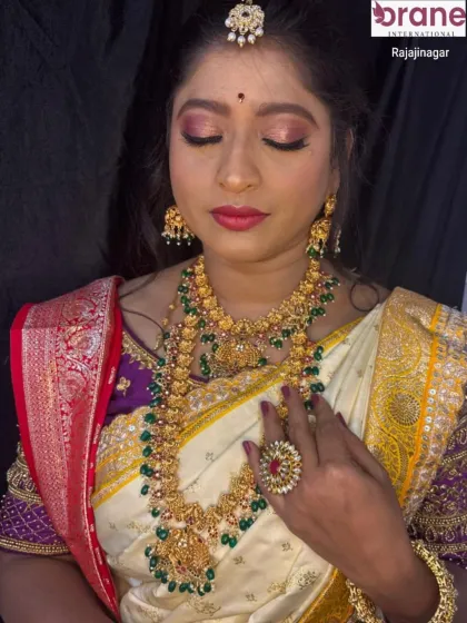 A close-up on the makeup, showing a soft-glam eye look with a pop of color on the lips, suitable for wedding ceremonies.