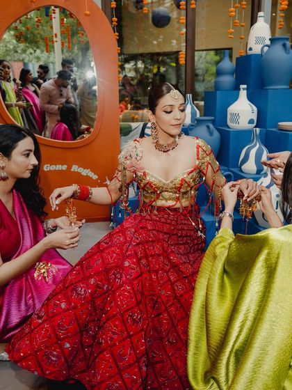 A beautiful shot of the bride interacting with her guests. The makeup is designed to look stunning from all angles and last through hours of celebration.