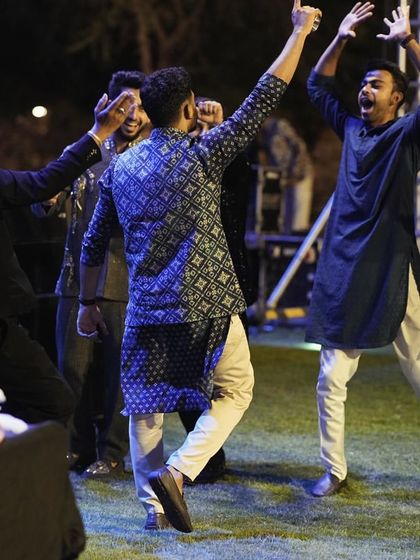 The energy at this Sangeet was electric. Here I am, dancing with the groom's friends, fully immersed in the celebration. This is what a full-on shaadi madness looks like.