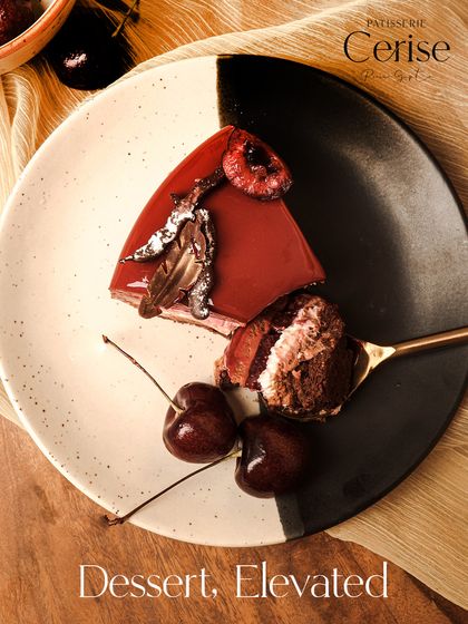 Dessert, Elevated. A slice of my Forêt Noire, showing the rich chocolate layers and cherry garnish.