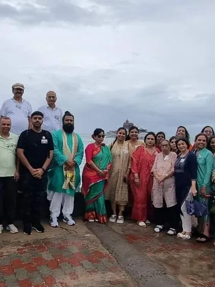 Our group at the southernmost tip of India, Kanyakumari, with the Vivekananda Rock Memorial and Thiruvalluvar Statue in the background. A moment of powerful spiritual significance.