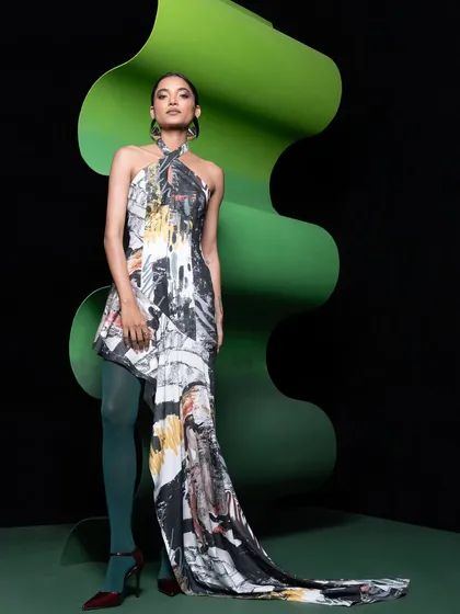 A dramatic, full-length gown from the Advait collection. I styled it with bold green tights to connect with the set design, creating a cohesive and high-fashion statement.