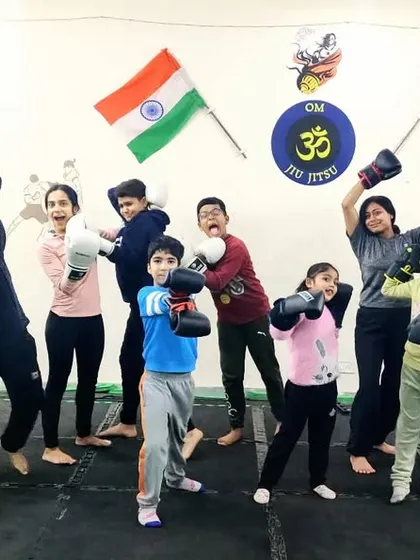 The joy of training together. This group photo captures the fun and camaraderie of our striking classes. We celebrate our hard work with high energy.