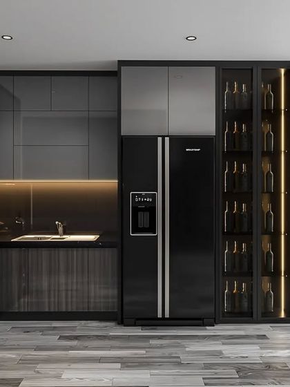 A luxurious open-plan kitchen with dark grey and wood-grain cabinets. A floor-to-ceiling glass wine cellar is integrated into the design, adding a sophisticated feature for entertainers and connoisseurs.
