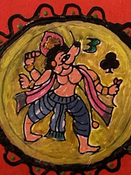 A hand-painted coaster with a Ganjifa card design. These pieces allow me to bring a touch of India's rich folk art traditions into everyday functional items like coasters.