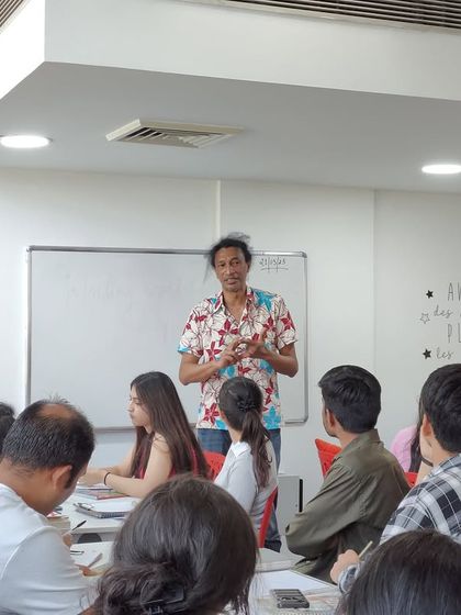 Author Johary Ravaloson leads a creative writing workshop for our students in the library. We provide unique opportunities for our students to learn directly from featured artists and authors.
