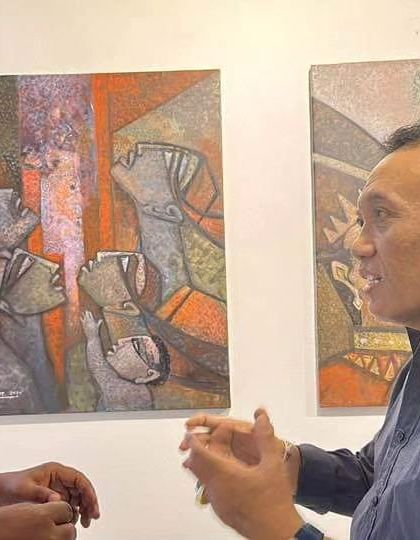Discussing my artwork with Mr. Agus Maha Usadha, Chief Director of the Tourism Department of Indonesia, at my art exhibition in Bali.