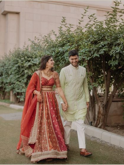 A candid moment of a couple walking and talking. The natural smiles and easy stride capture the comfortable and joyful connection they share, making for a beautiful, relaxed portrait.