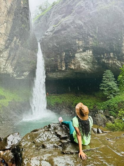 A moment of peace and admiration at Devkund waterfall. The beauty of this place makes you want to sit and soak it all in.