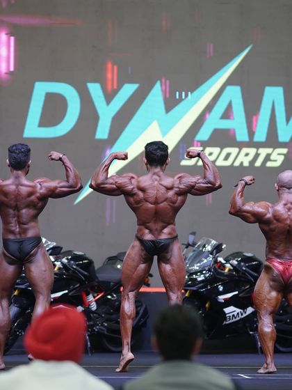 Another view of the rear double bicep pose on stage.