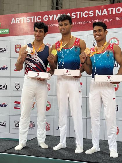 Three champions on the podium at the Artistic Gymnastics National Championships. This image captures the spirit of competition and the success of our training program.