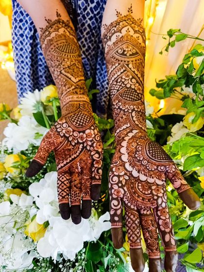 A beautiful shot of a full bridal design amidst fresh flowers.