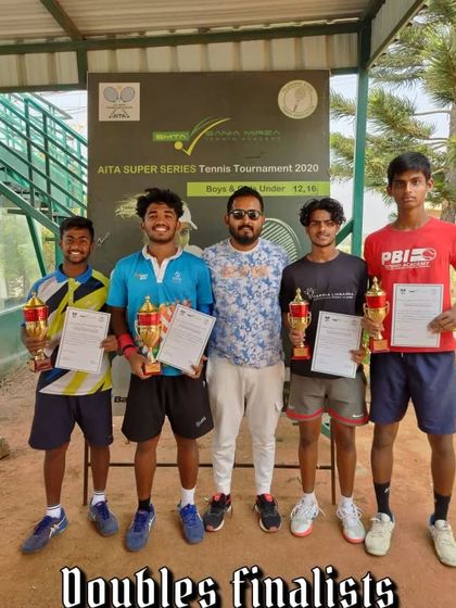 The doubles finalists, including our player Naishik, at the AITA Super Series tournament.