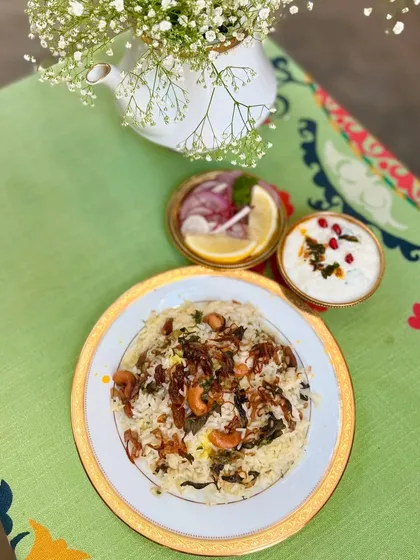 Our Malabar Chicken Biryani, a highlight of the Iftar menu. This Mappila classic combines slow-cooked chicken and native spices with Persian-inspired dum cooking for a soul-satisfying meal.