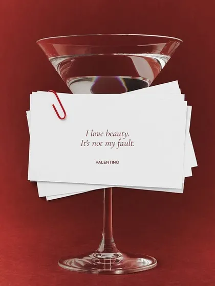 A martini glass holding a quote from Valentino, "I love beauty. It's not my fault." This was part of an in-store cocktail event we designed, using the founder's own words to set a chic, confident tone.