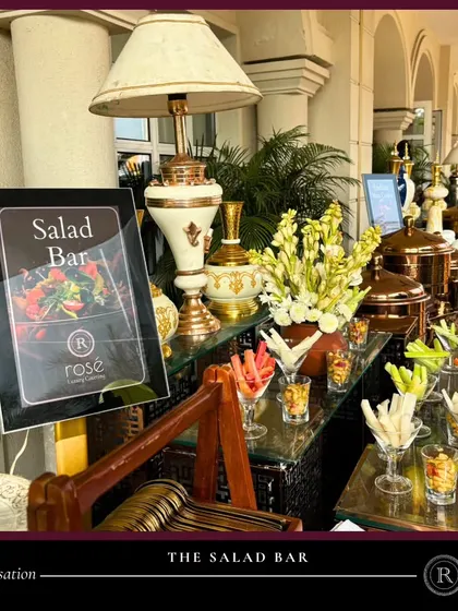 Our salad bar is a sensation in itself. The station is beautifully decorated with elegant lamps and vases, offering a refreshing and healthy selection of vegetables and toppings in stylish glassware.