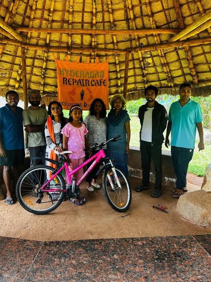 The team and participants at our Hyderabad Repair Cafe pose with a newly fixed bicycle. Even with a modest turnout, the community spirit was strong.