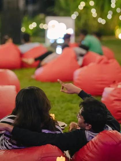 A perfect date night or a chill evening with friends at our Sunset Cinema Club screening. Cozy beanbags, a giant screen, and the open sky create an unforgettable movie experience.