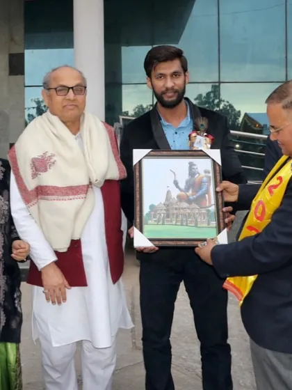 Another view of me presenting my artwork at my school's event. The piece features Lord Ram in front of the newly built Ram Mandir.