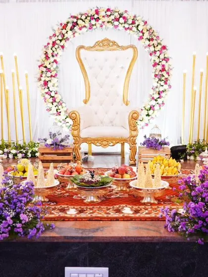 For this baby shower, we designed an elegant and serene stage with a throne for the mother-to-be. The floral ring and candle-lit backdrop created a warm, celebratory atmosphere, perfect for welcoming a new life.