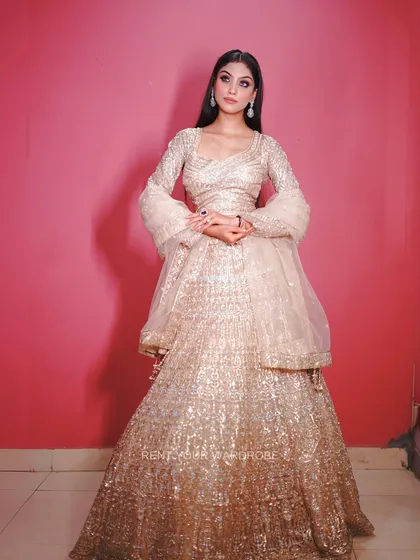 This angle shows the beautiful flare of the lehenga and the sheer dupatta.