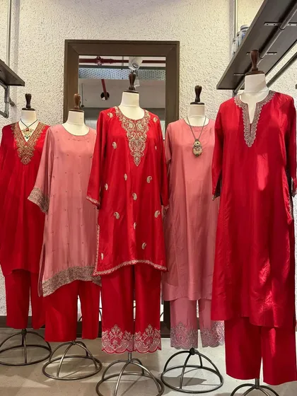A beautiful array of red and pink silk kurtas from Brih, each featuring unique and delicate silver embroidery.