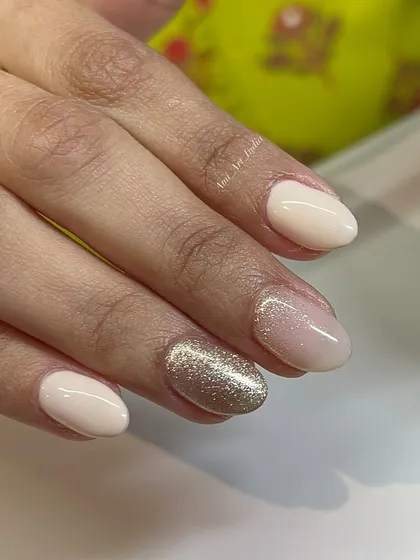 An elegant and simple combination of nude, sheer pink, and a brilliant gold glitter nail.