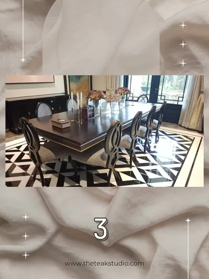 A different angle of a classic, rectangular dark wood dining table. The high-gloss finish and clean lines, paired with intricately designed chairs, create a formal and elegant dining setting.