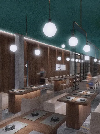 Booth seating at CHAMPON, designed for a more intimate dining experience. The wood paneling and suspended globe lights contribute to a warm and private atmosphere, consistent with our minimalist approach.