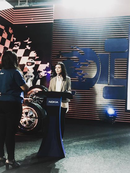 Receiving instructions from the show producer from Wizcraft during a Nokia event. Live events are a team sport, and clear communication with the production team is essential for a flawless execution.