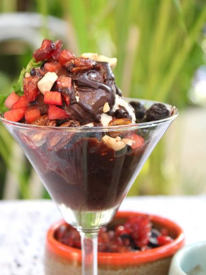 A close-up of our Chocolate Sundae, showcasing the layers of brownie, ice cream, and fresh fruit. It's a treat for all your senses.