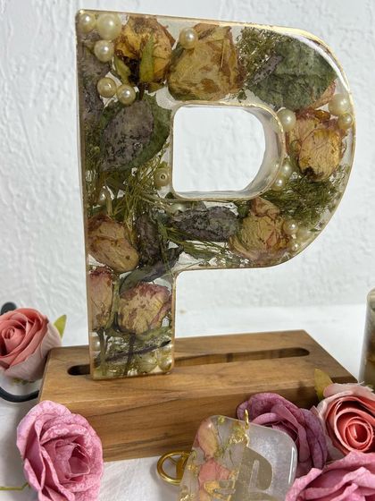 A 'P' initial lamp created with preserved bouquet flowers. This is a wonderful way to turn a special occasion bouquet into a lasting and functional piece of art.