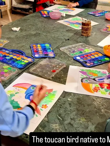 Students aged 6 to 9 work on their watercolor paintings of the toucan, a bird native to Mexico, as part of our themed project.