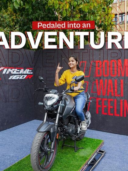 A student poses on a Hero Xtreme 160R at one of our campus photo booths. These displays allowed students to get up close with the bikes and created great photo opportunities.