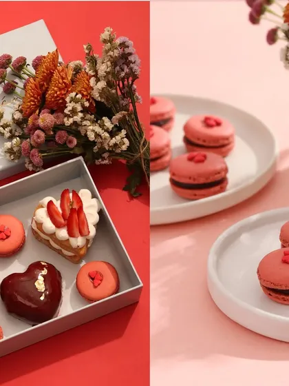 A Valentine's Day dessert box styled with fresh flowers to create a premium, giftable look. This shot combines different types of desserts to showcase the variety available in a special themed collection.