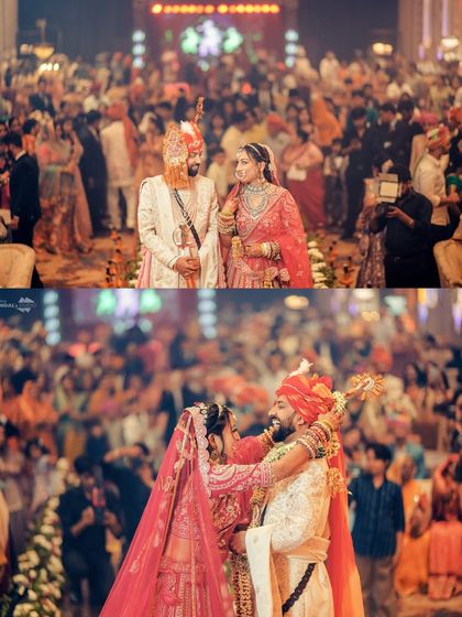 The Varmala ceremony, surrounded by a sea of loved ones. I capture both the wide shot showing the scale of the celebration and the close-up of the couple's joyful embrace.