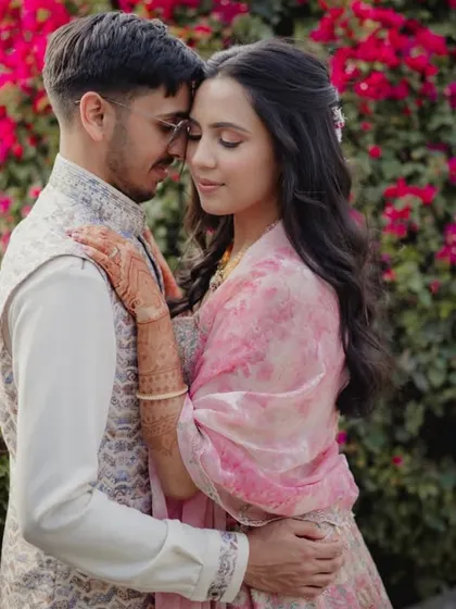 A romantic, intimate portrait of the couple, finding a quiet moment together during their Mehendi celebration.