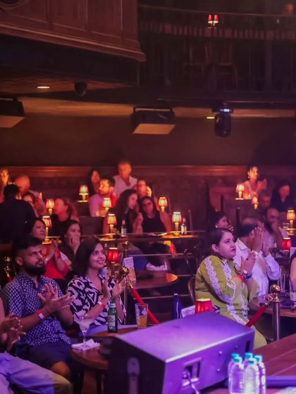 A packed house at The Piano Man enjoying David Walters' concert. This shows that our cultural events extend beyond our campus, collaborating with popular venues across Delhi.