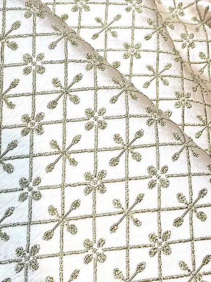 This geometric patterned fabric in a neutral tone provides a modern yet traditional look for a custom Indo-Western jacket or kurta.