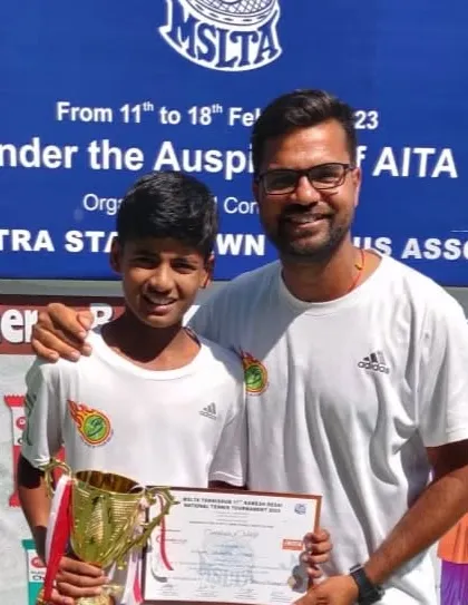 A proud moment with the head coach. I am with Rishikesh after he received his trophy and certificate for being the U12 National Runner-Up.