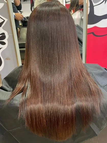 This is the result of a smoothing treatment done by one of my students. The hair is left incredibly straight, shiny, and healthy looking.