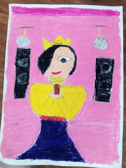 Anaya, a 5th standard student, drew this picture of a singer on stage. This creative drawing uses oil pastels to create a fun, musical scene.